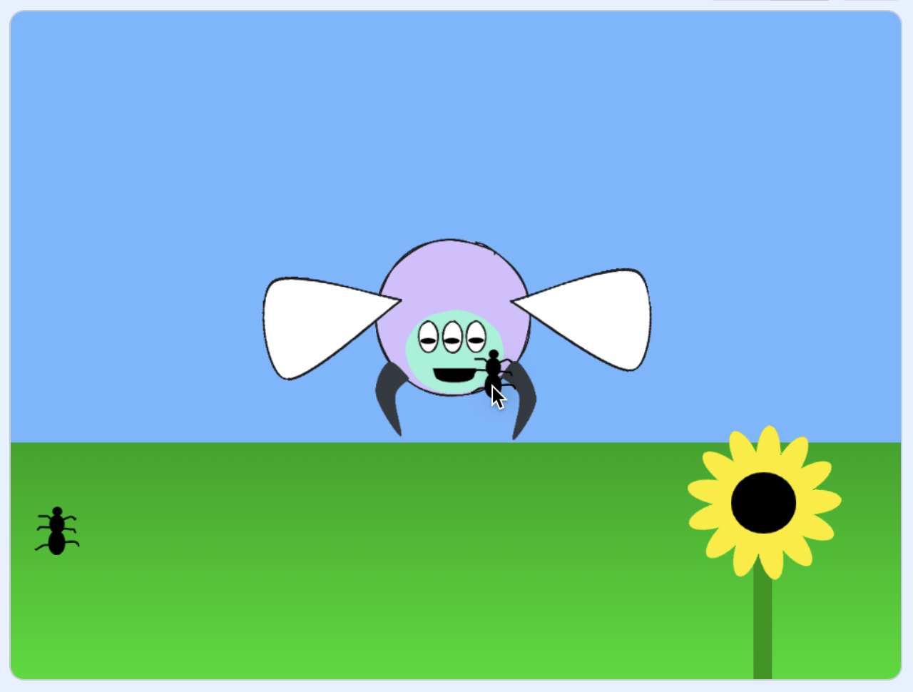 A cartoon illustration of a colorful flying insect with three eyes hovering in a blue sky above green grass. The creature has a purple head, mint green face with three oval eyes and a smiling mouth, white wings on either side, and dark gray claws. A cursor pointer is visible near its mouth, holding a small ant that will be fed to the creature.